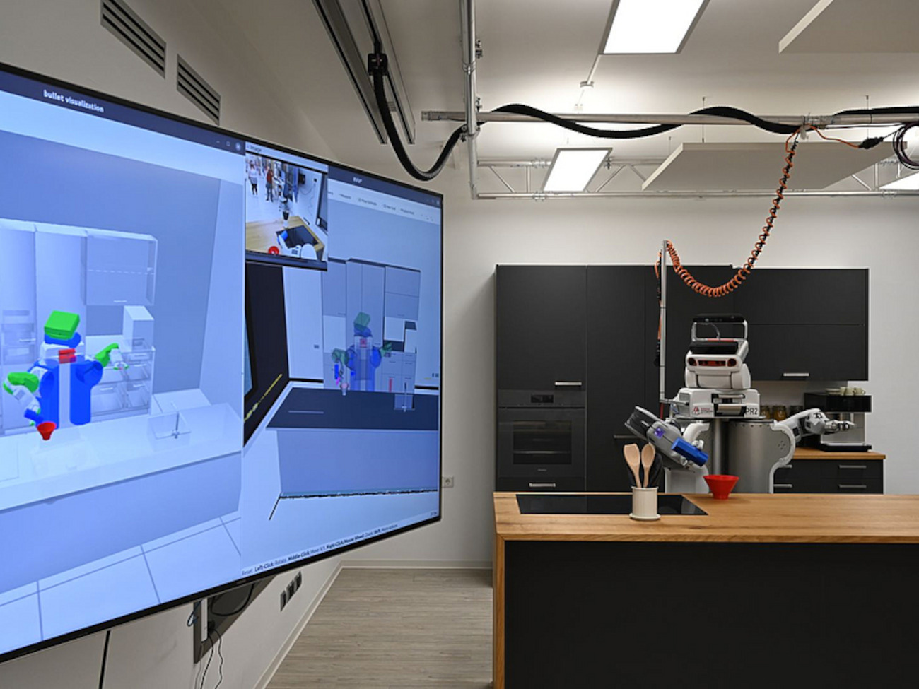 Ein Roboter arbeitet in einem Labor, das mit einer Küche eingerichtet ist