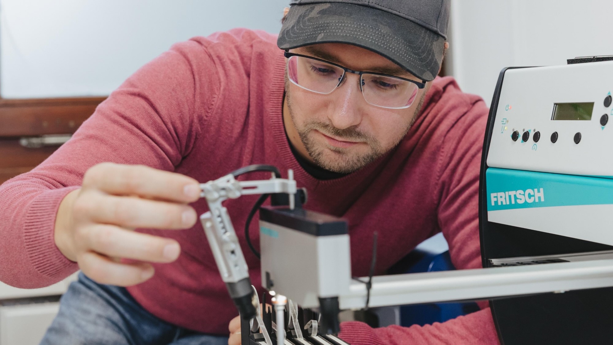 Employee Janek Otto handles sensor boards.