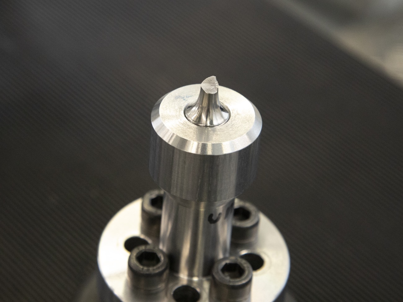 A metallic object with a break edge