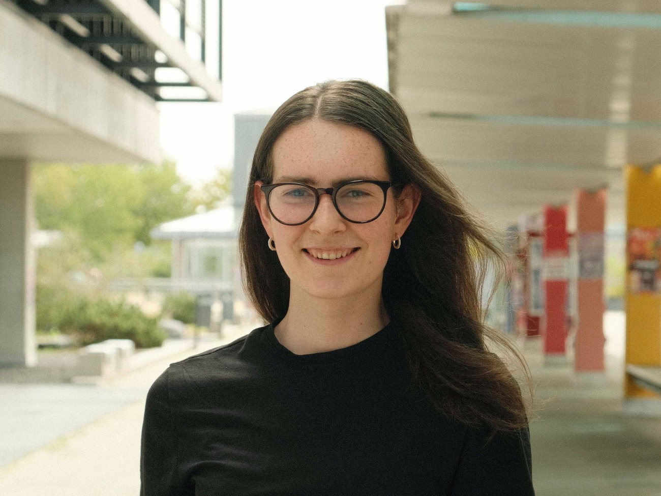 A women smiles at the camera.