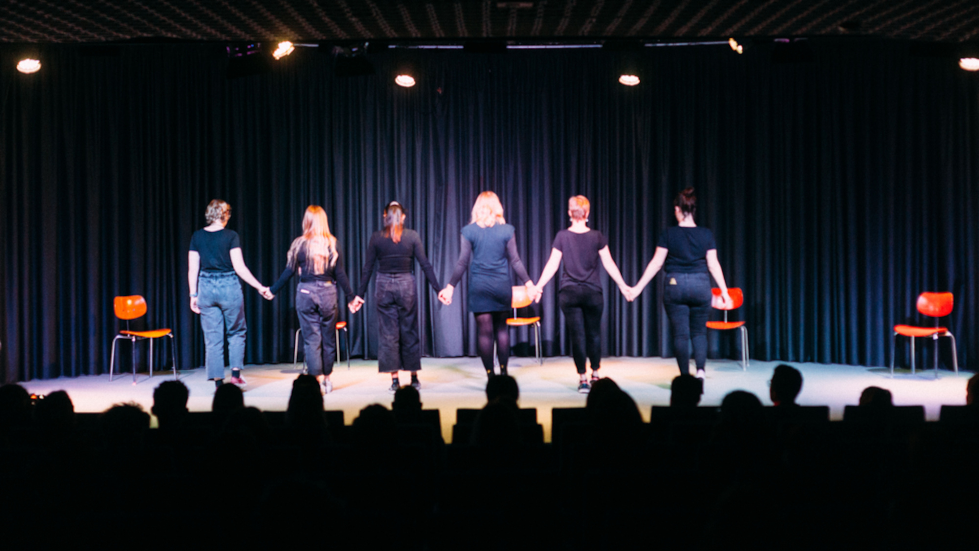 Students on stage at the theater performance 