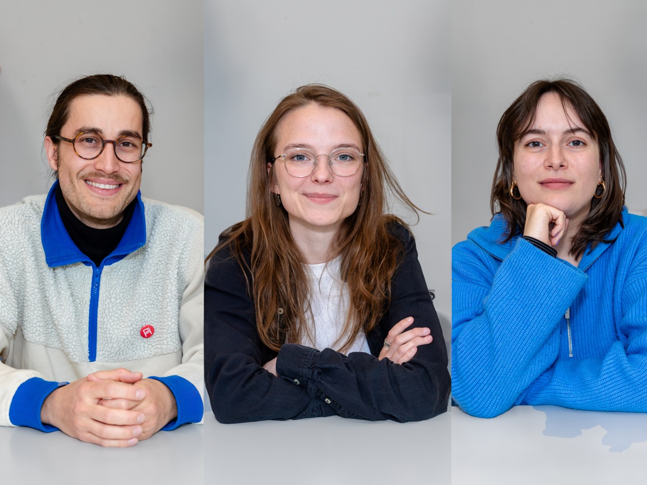 Drei Studierende nebeneinander im Portrait