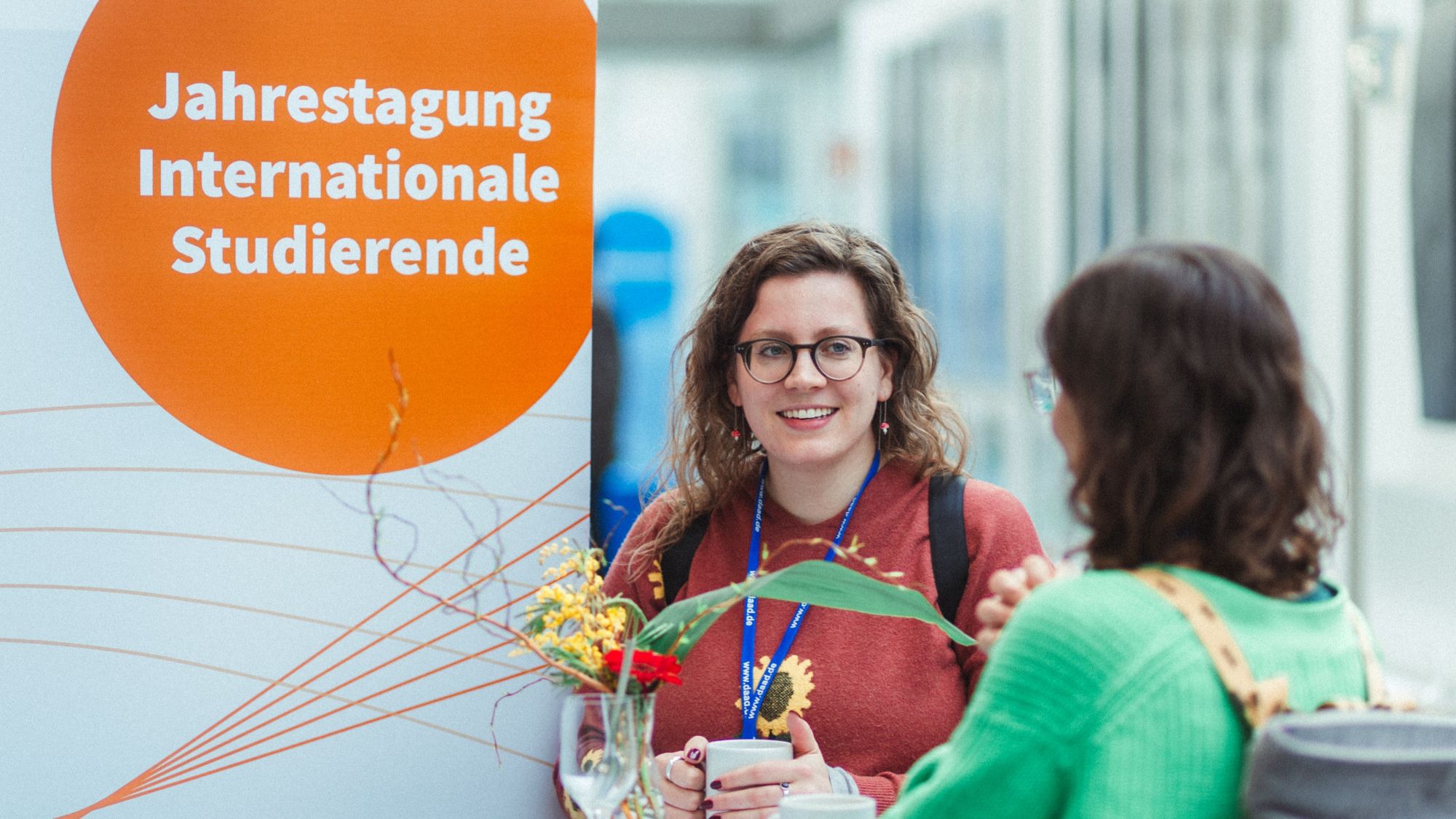 Two people are sitting at a table.